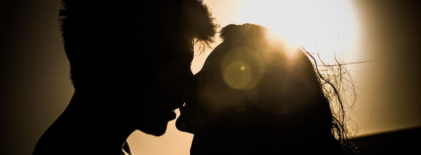 couple in kissing embrace