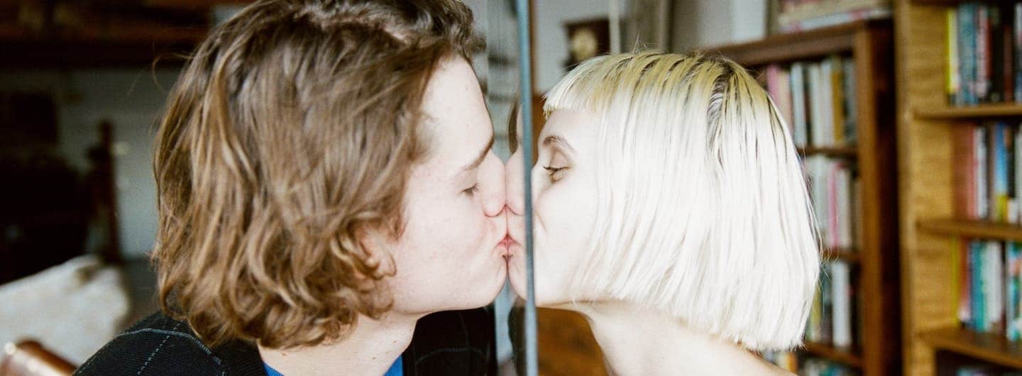 couple kissing through a glass